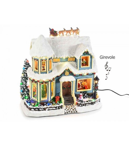 Weihnachtshaus mit bunten Lichtern, Bewegung und Musik - 